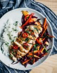 Inspired by Thai flavors, this meal prep chicken features juicy pan-seared chicken breast and is served alongside a vibrant red cabbage and mango slaw and sticky jasmine rice. It's perfect for work lunches or a fresh dinner.