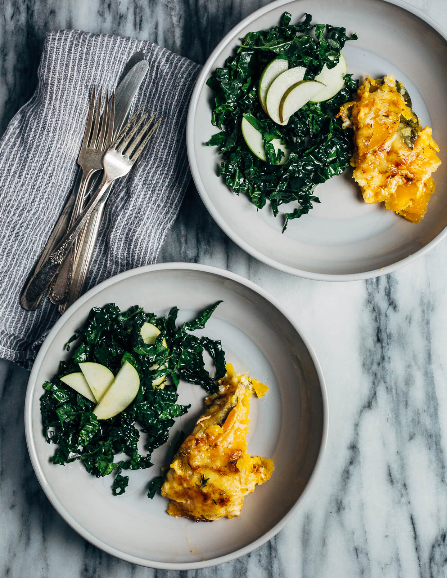 An autumnal butternut squash gratin made with a mix of Emmentaler and Gruyere cheeses, fresh thyme, and bay leaves. This hearty gratin is perfect as part of a cozy fall supper or as a Thanksgiving side.