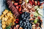 A creative charcuterie graze board that doubles as an eye-catching centerpiece for autumn gatherings. Featuring an assortment of meats, fresh fall fruit, and cheese crisps this charcuterie graze board comes together in minutes.