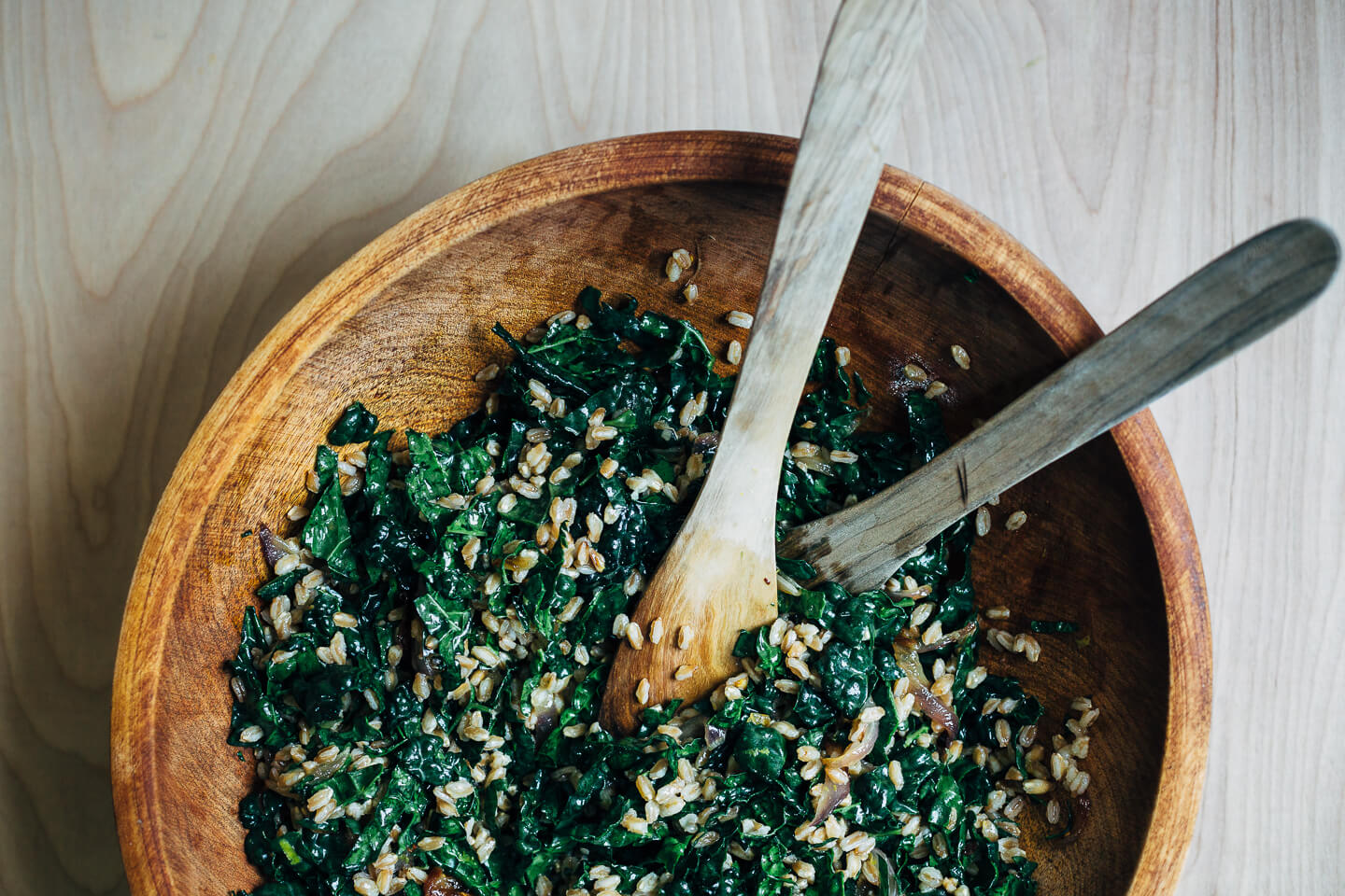 This nutty toasted farro salad features al dente farro tossed with massaged kale and ruby-hued fresh figs topped with creamy goat cheese crumbles and fresh parsley.