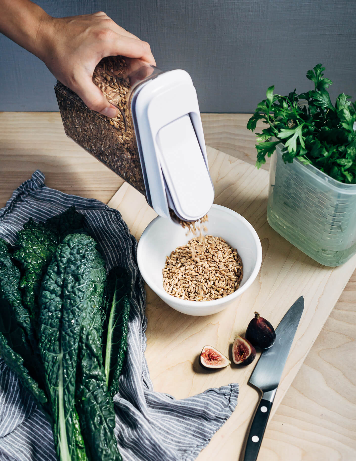 This nutty toasted farro salad features al dente farro tossed with massaged kale and ruby-hued fresh figs topped with creamy goat cheese crumbles and fresh parsley.