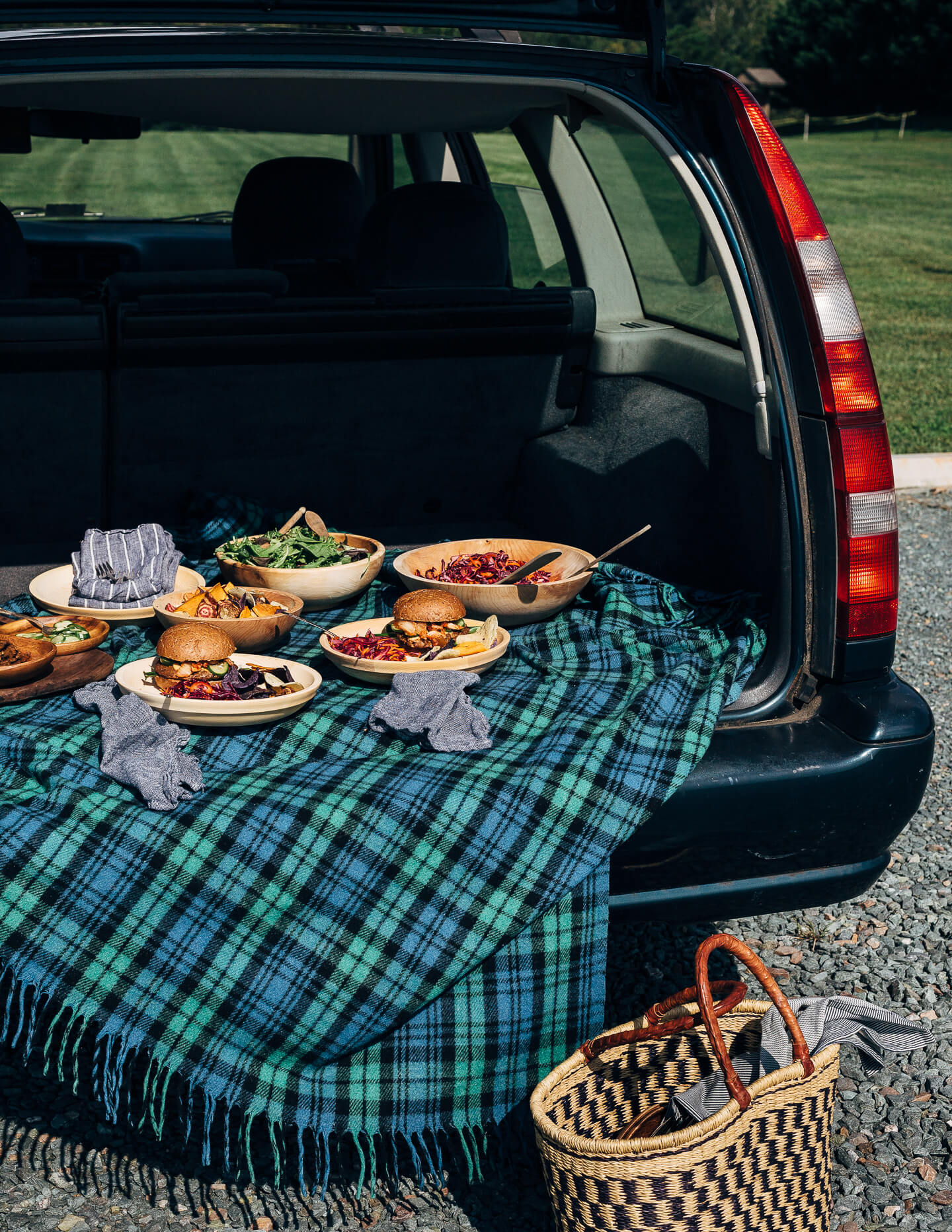 A fresh spin on the traditional tailgating party featuring plant-based kimchi burgers topped with grilled green onions and a spicy gochujang sunflower spread.