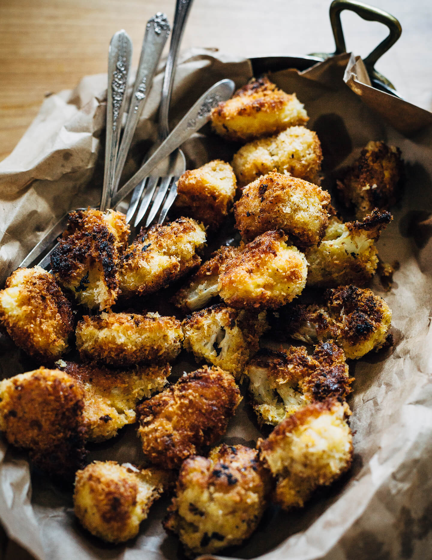 A simple, classic beer cheese recipe served alongside crispy fried cauliflower bites, toast soldiers, and crunchy dark pretzels.