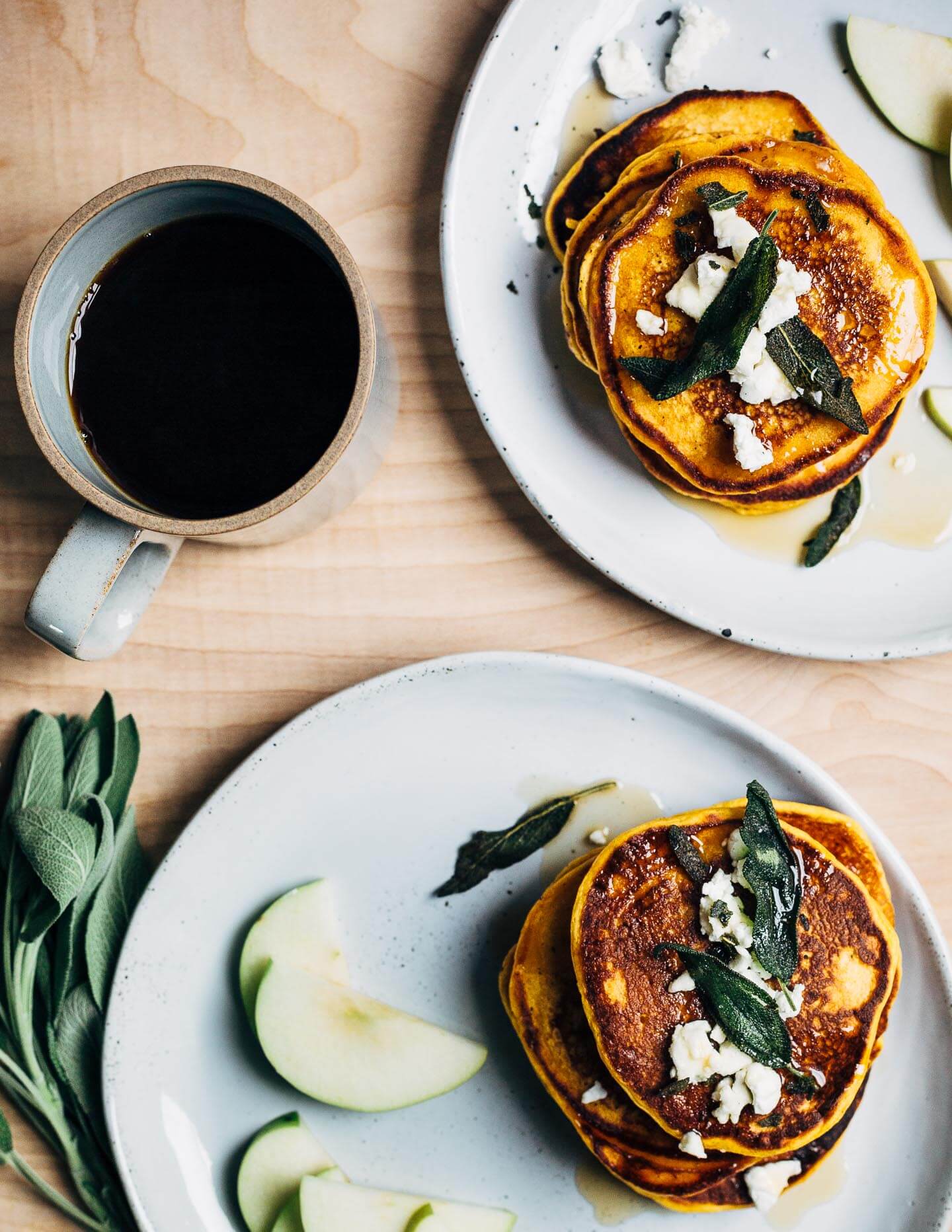 An autumnal sweet potato pancake recipe topped with fried sage leaves and crumbled goat cheese.