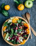 A bright and crunchy green apple and beet salad recipe featuring sliced green apples, marinated beets tossed with red wine vinegar and shallot, beet greens, spinach, herbed goat cheese crumbles, and a simple vinaigrette.
