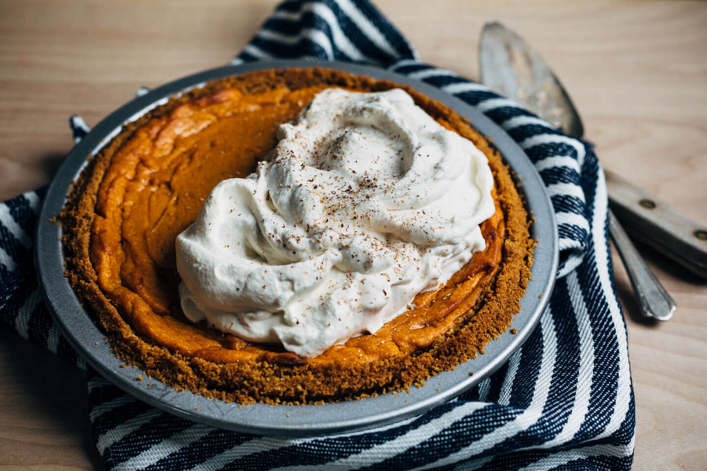 End your Thanksgiving feast with this light and silky bourbon-spiked sweet potato pie baked in a classic graham cracker crust and topped with a big dollop of brown sugar whipped cream. 