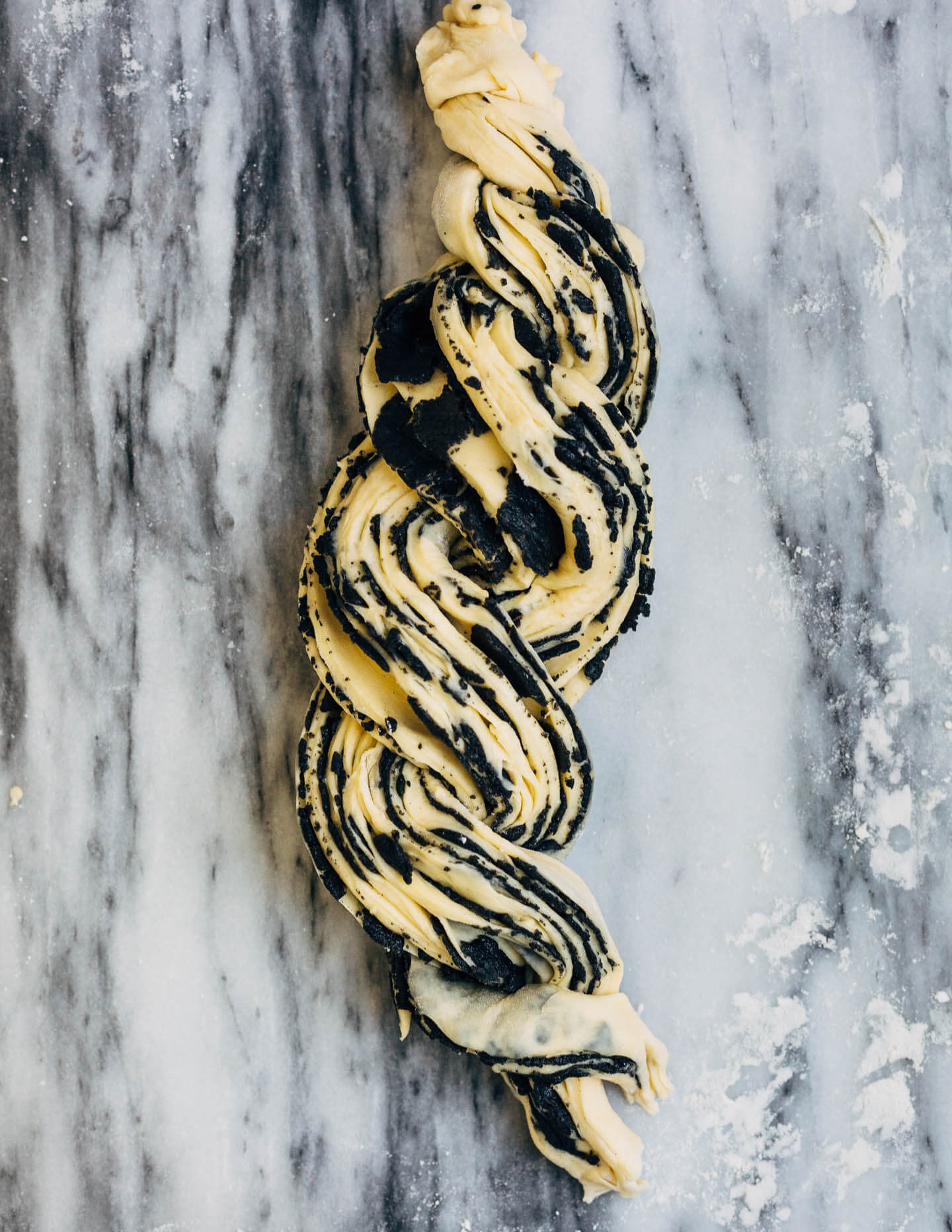 A sweet and pillowy yeasted twist bread recipe with nutty swirls of black sesame paste, from A Common Table by Cynthia Chen McTernan.