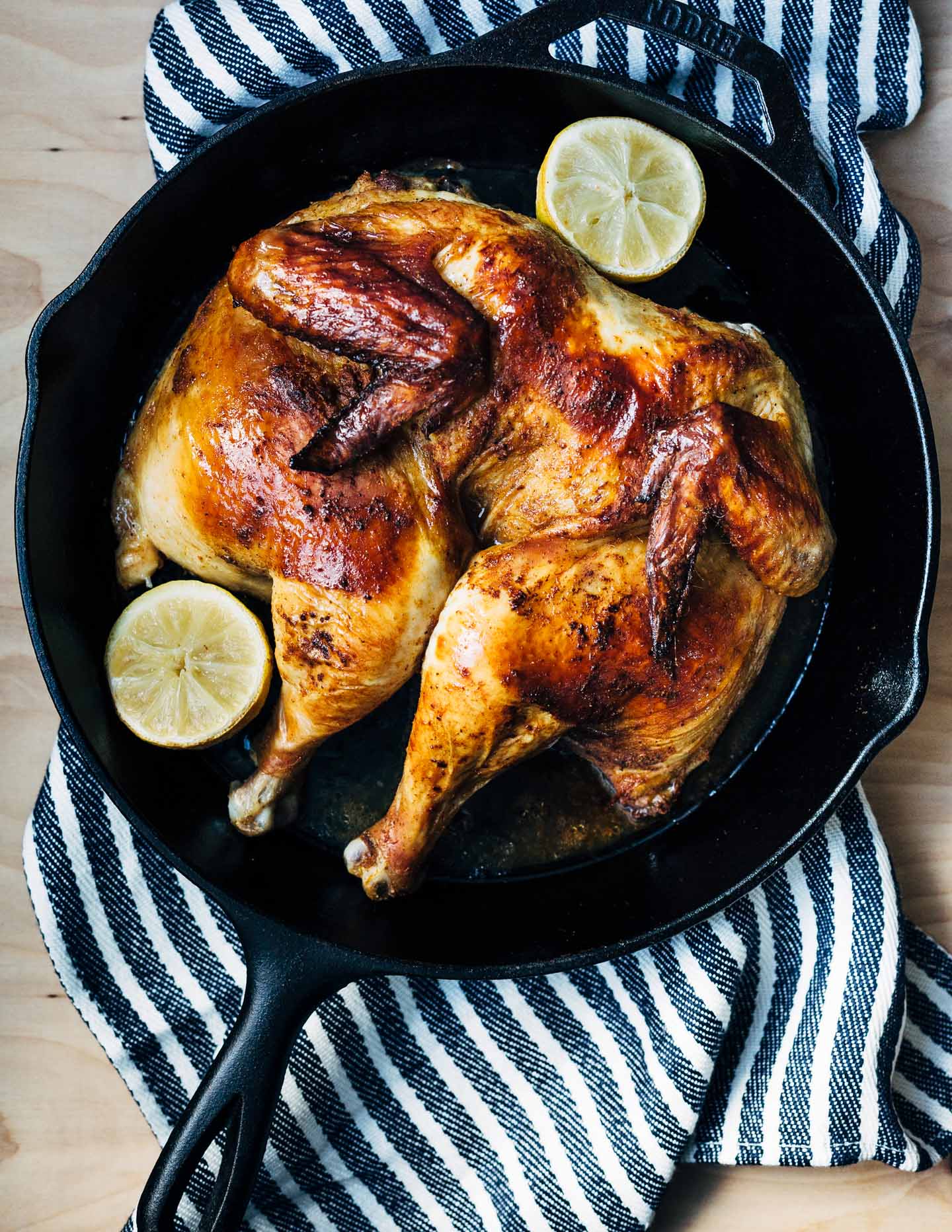 A simple and delicious holiday feast featuring crispy roasted spatchcock chicken with buttery sheet pan smashed potatoes and Brussels sprouts. 