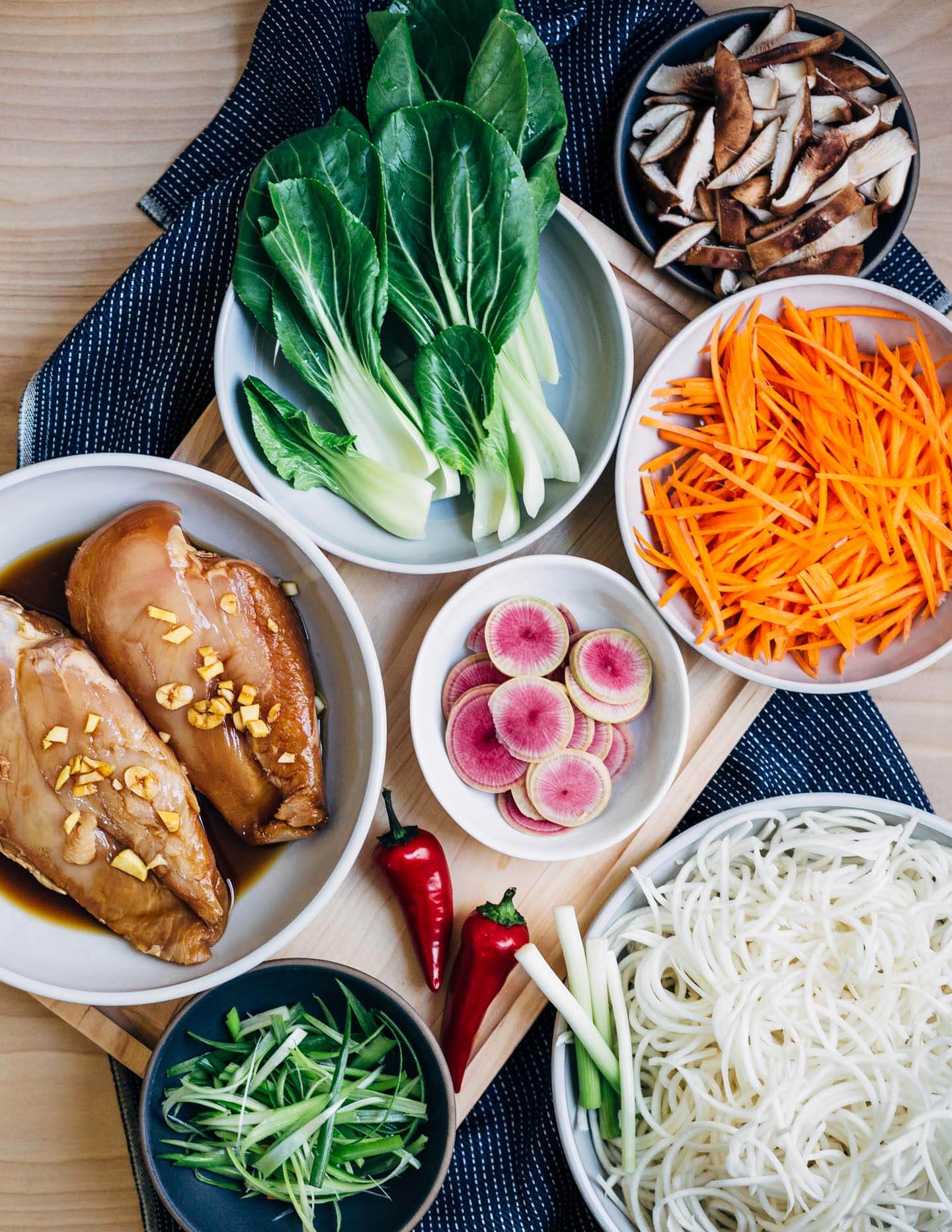 A restorative turnip noodle ramen recipe featuring tender turnip noodles and a host of winter vegetables served in a rich ramen broth topped with juicy, flavorful steamed chicken breasts. Recipe is naturally gluten-free and includes a simple Whole30-compliant variation.