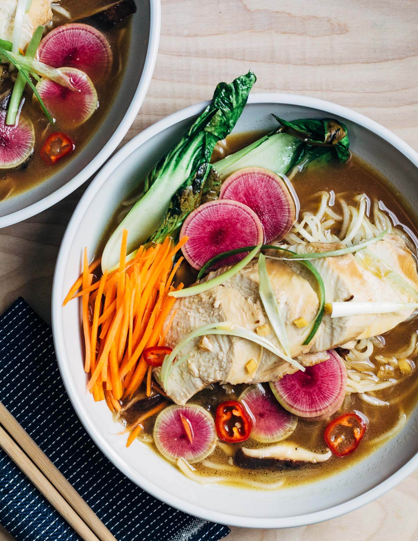 A restorative turnip noodle ramen recipe featuring tender turnip noodles and a host of winter vegetables served in a rich ramen broth topped with juicy, flavorful steamed chicken breasts. Recipe is naturally gluten-free and includes a simple Whole30-compliant variation.