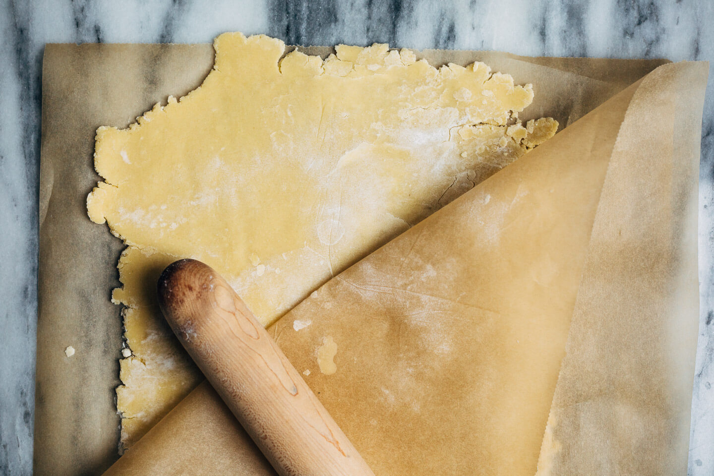 A bright and creamy grapefruit curd tart baked up in a classic pâte sucrée crust that's perfect for celebratory winter meals.