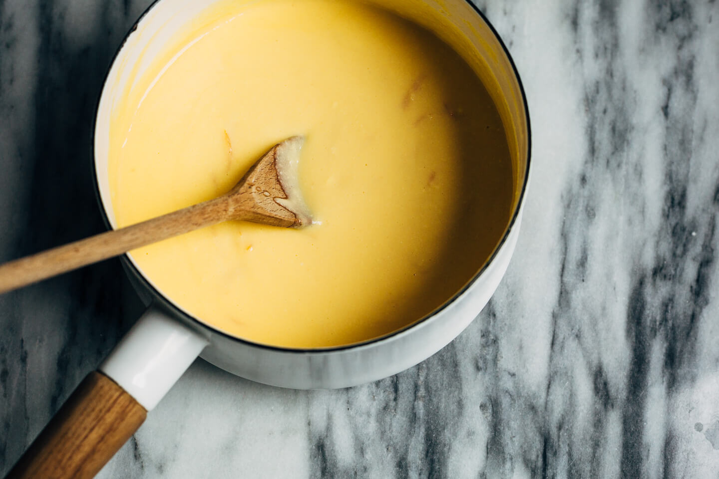 A bright and creamy grapefruit curd tart baked up in a classic pâte sucrée crust that's perfect for celebratory winter meals.