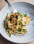 Fettuccine tossed with roasted spring onions, tinned sardines, capers, herbs, and buttery panko makes for a simple and hearty early spring meal.