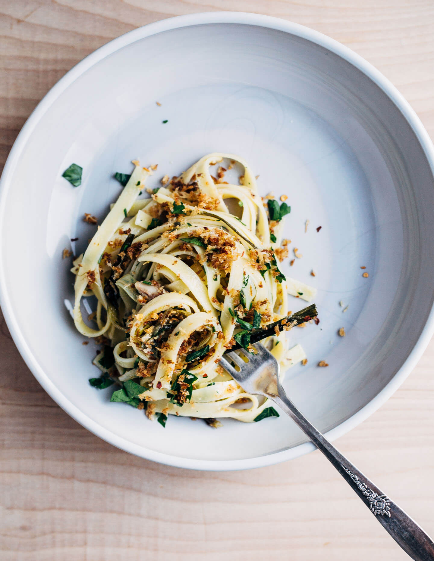 A hearty dish for early spring that's at once briny, rich, and herbaceous. Fettuccine noodles are tossed with delicate roasted spring onions, capers, herbs, tinned sardines, and buttery panko for a meal that's deeply satisfying. 