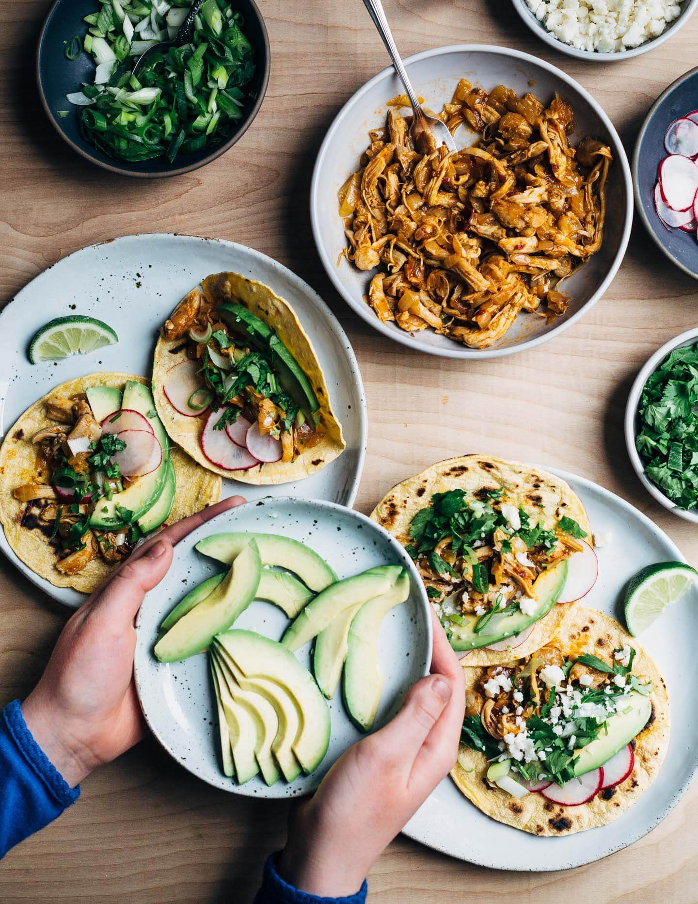 Chipotle chilies in adobo sauce lend smoky heat to these classic chicken tacos topped with avocado, radish, cilantro, and crumbled cotija. This post was created in partnership with SVO Farmer Focus Chicken. 