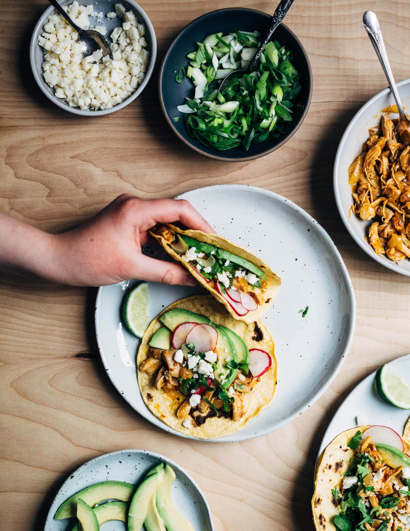 Chipotle chilies in adobo sauce lend smoky heat to these classic chicken tacos topped with avocado, radish, cilantro, and crumbled cotija. This post was created in partnership with SVO Farmer Focus Chicken. 
