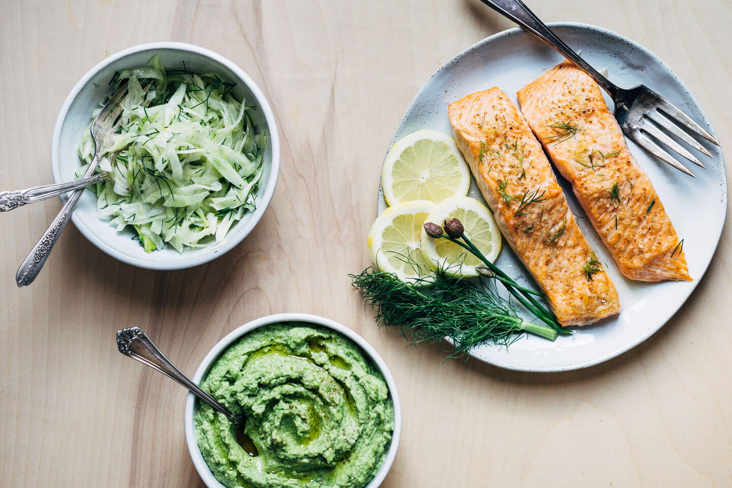 A creamy, mild asparagus pesto that tastes like spring! Made with garden chives, soaked sunflower seeds, and Parmesan, it's perfect served alongside broiled salmon and lemony fennel slaw. 