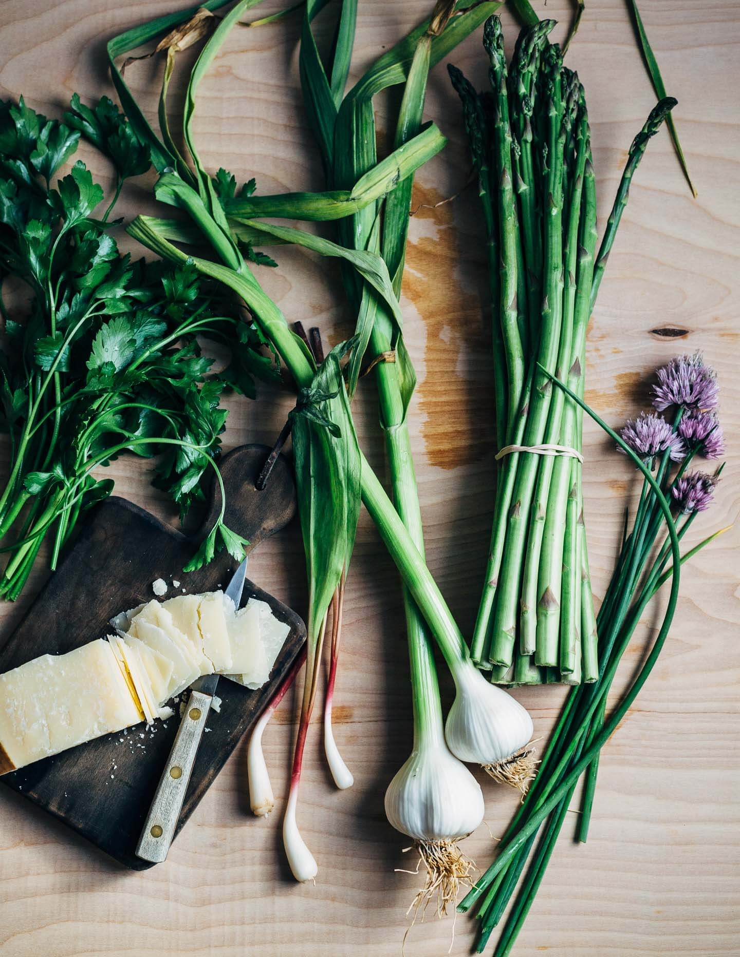 Creamy farro risotto (aka farrotto) with all the best spring things like ramps, young garlic, chives, and roasted asparagus. 