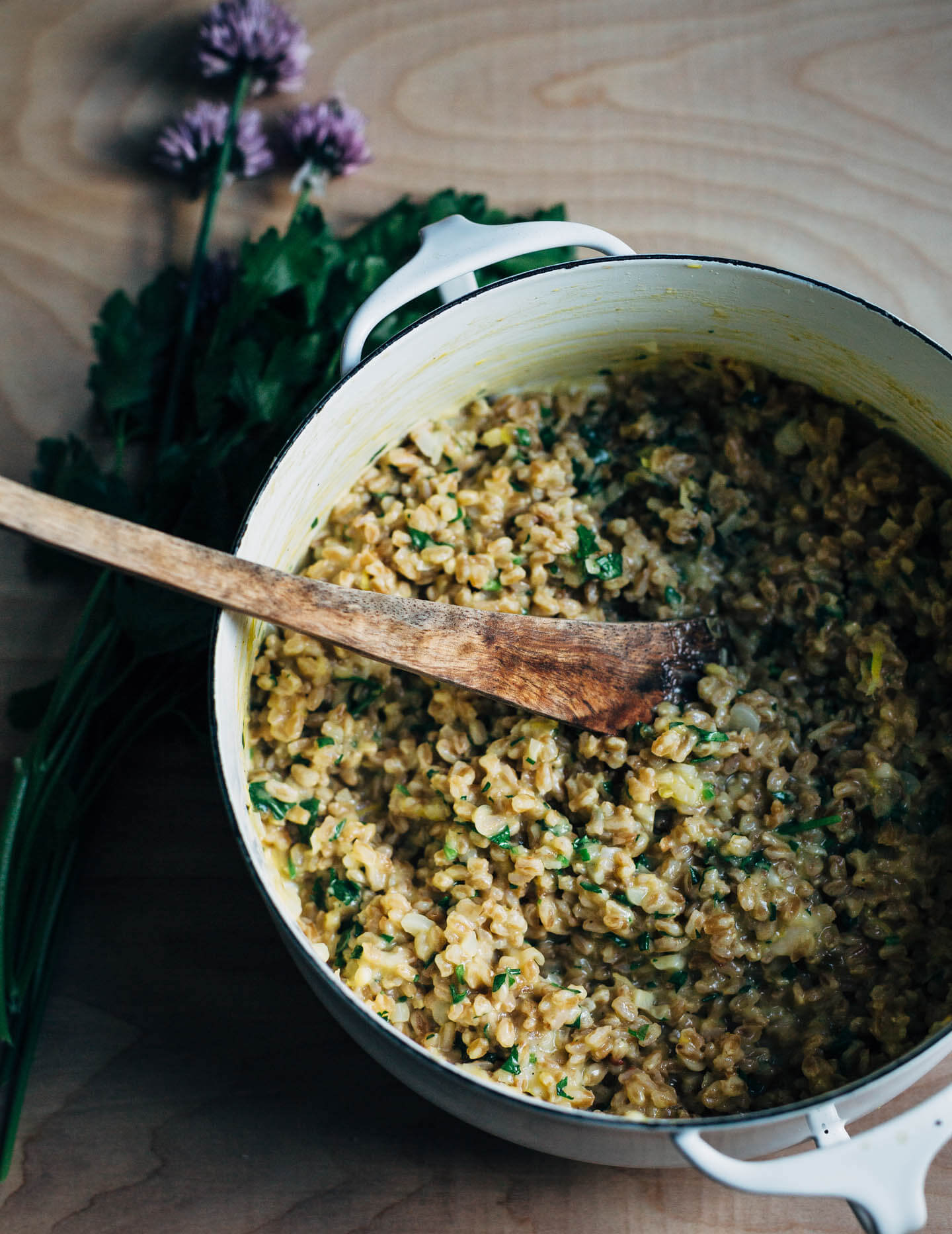 Creamy farro risotto (aka farrotto) with all the best spring things like ramps, young garlic, chives, and roasted asparagus. 