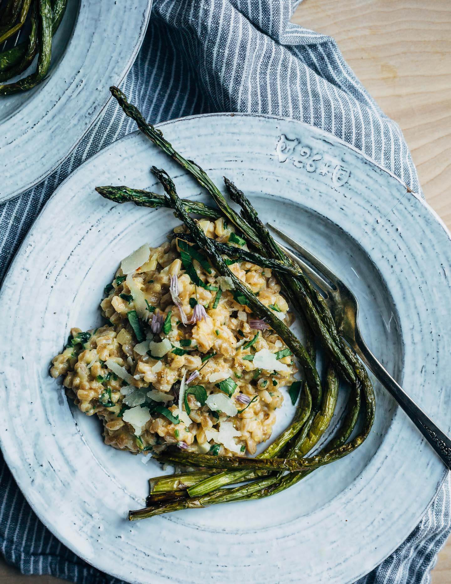 Creamy farro risotto (aka farrotto) with all the best spring things like ramps, young garlic, chives, and roasted asparagus. 