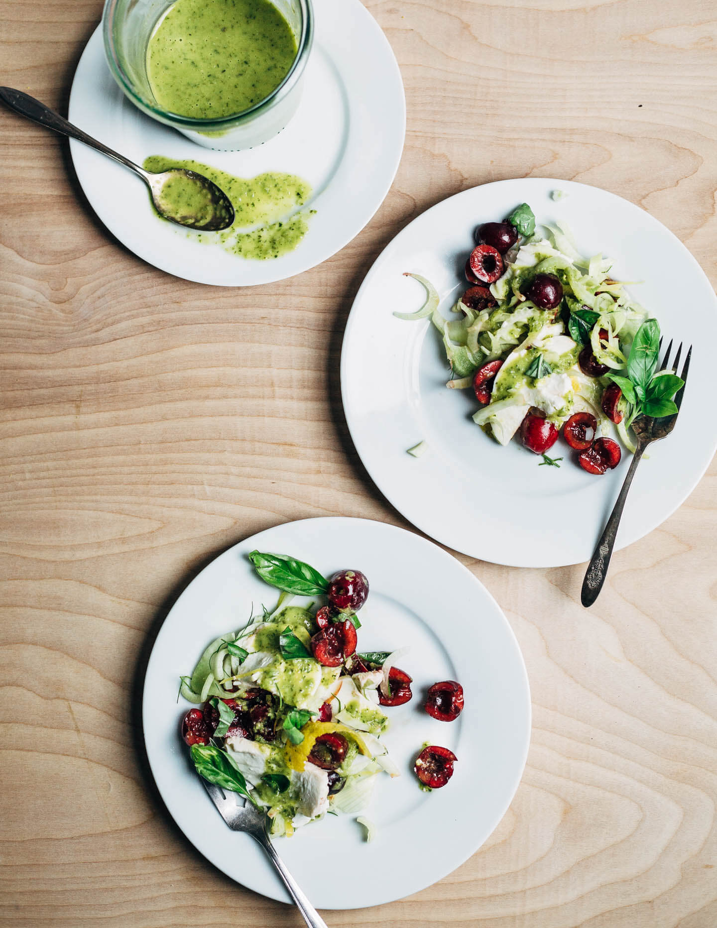 Shaved fennel and sweet Bing cherry Caprese salad drizzled with a fresh basil and green onion dressing.