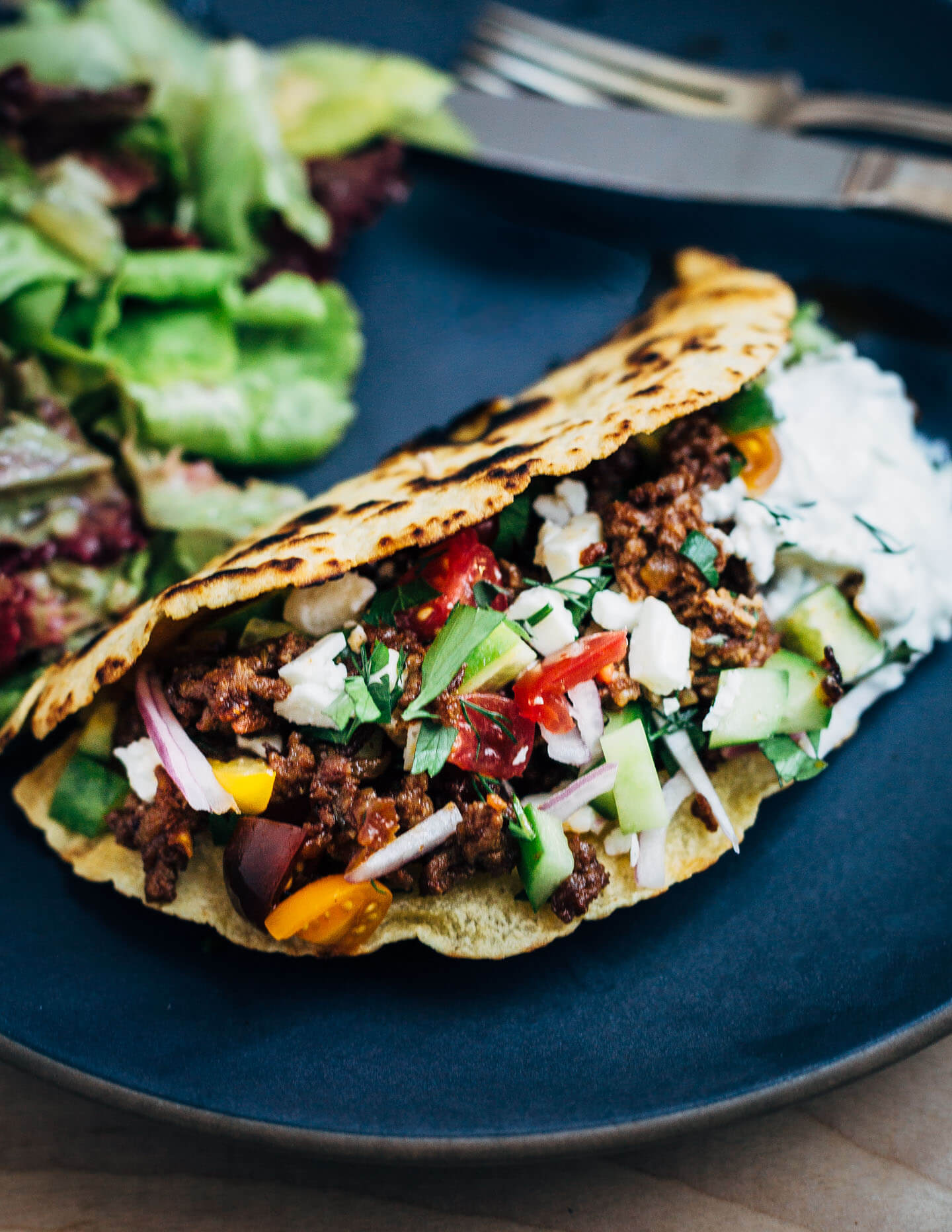 Greek-inspired lamb tacos are a revelation. They're proof that a great dinner can be as simple as sautéing meat with alliums and spices, and chopping up a few vegetables. Add a side salad and rice, and you have a simple dinner that's ready in under 30 minutes.