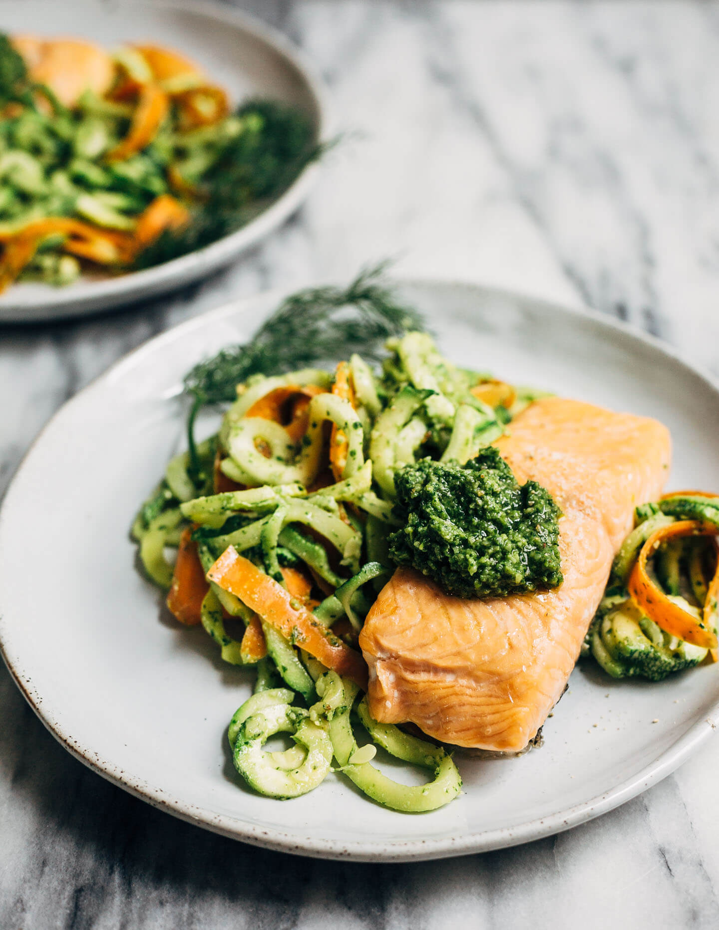 Cilantro pesto makes zucchini noodles and salmon pop. 