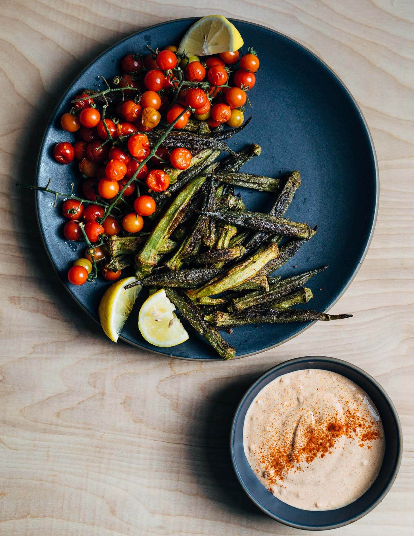 Crispy roasted okra and cherry tomato bunches are served alongside an irresistible (cheater) pimentón aioli.