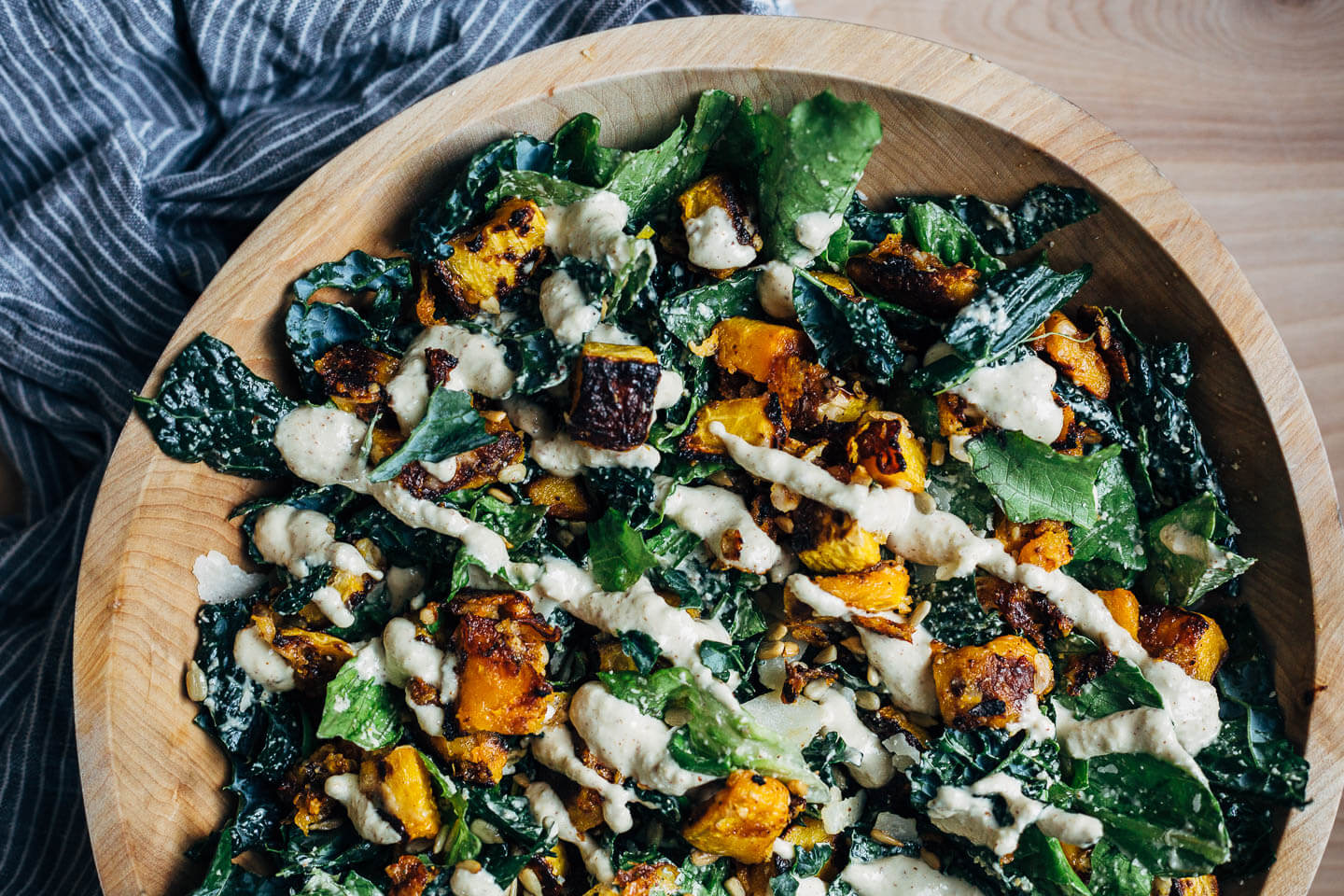 A richly flavored kale Caesar salad with roasted butternut squash and sunflower seed Caesar dressing. 