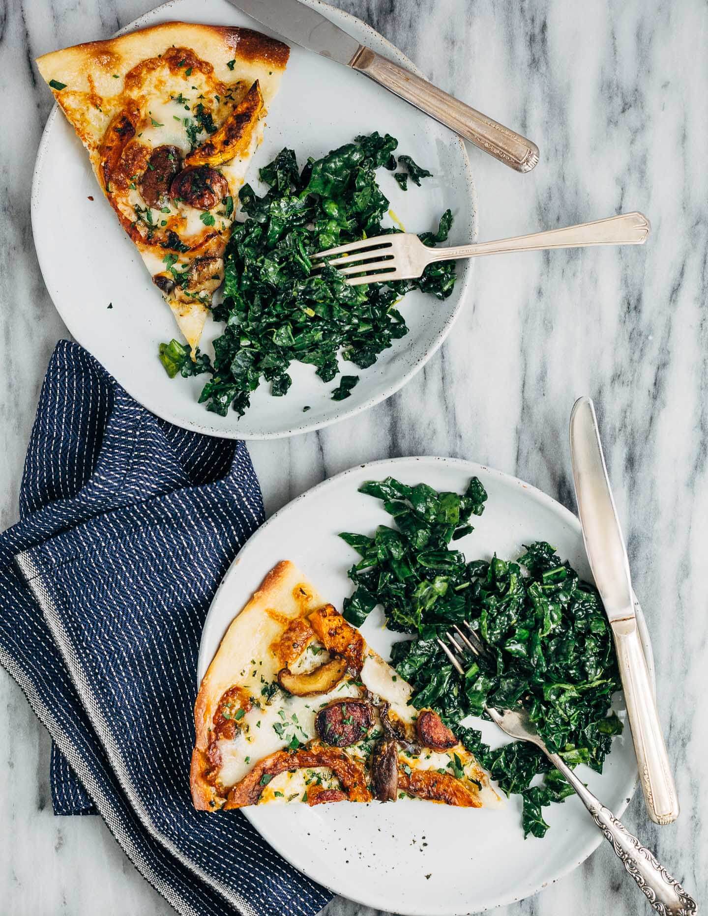 A simple fall meal featuring butternut squash and sausage pizza and a simple kale salad.