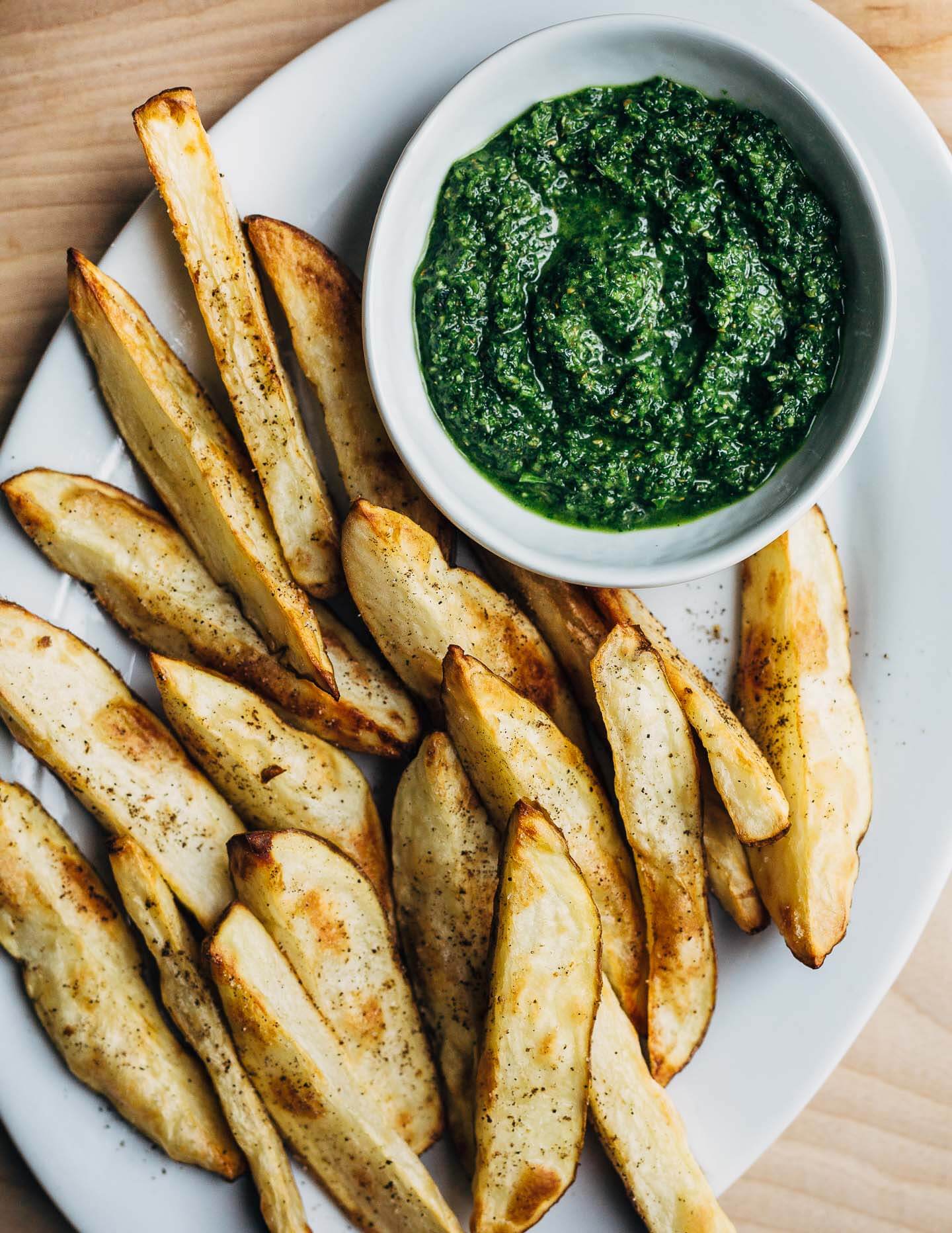 Perfectly crisp roasted potato wedges are an ideal complement to spicy, herbaceous zhug, the Yemeni condiment you'll want to put on everything. 