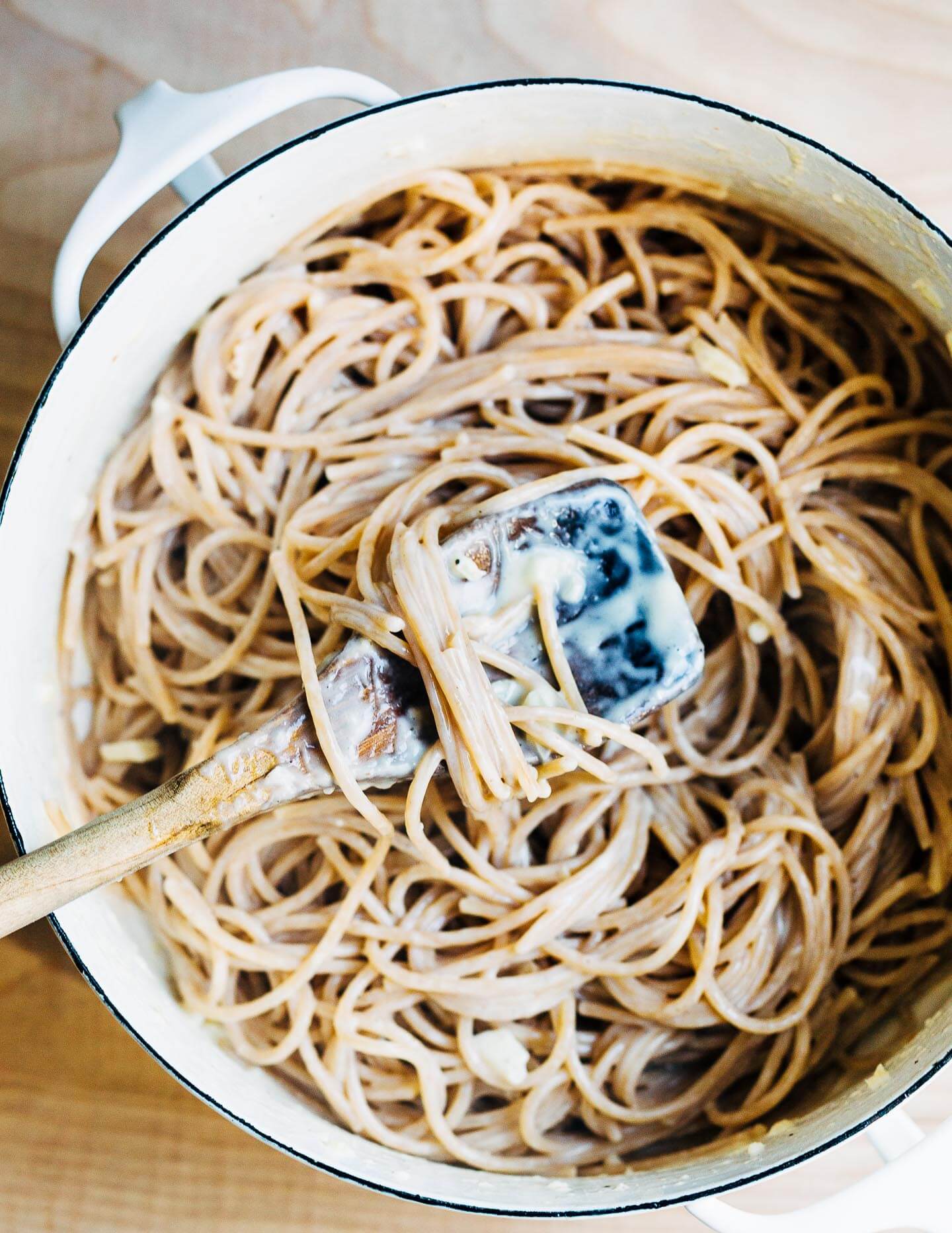 Speghetti tossed with Parmesan sauce.