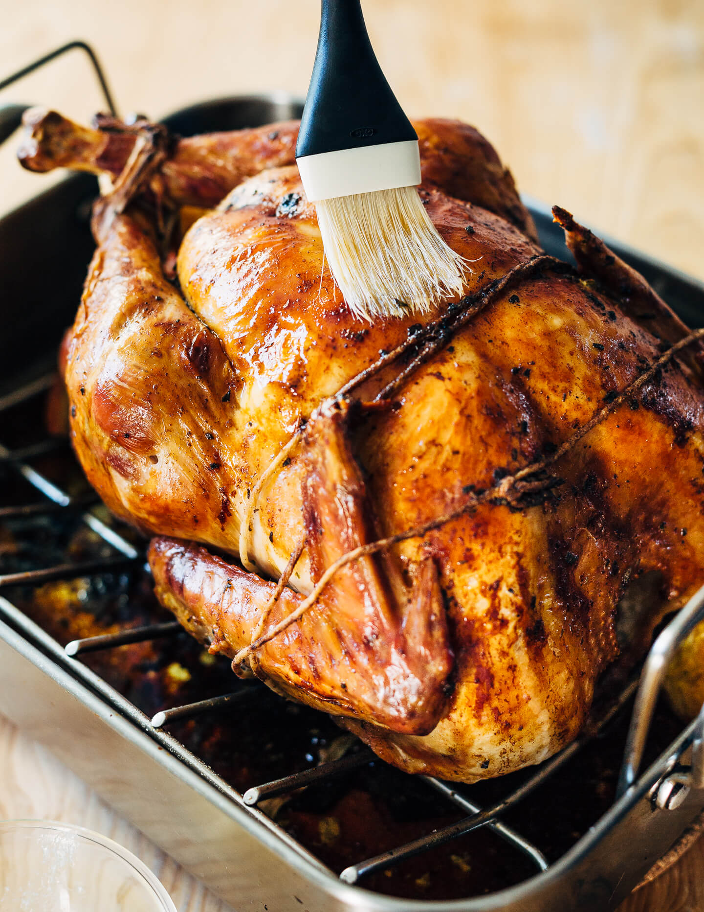 Brushing the turkey with melted butter helps get golden, crisp, exceptionally flavorful skin. 
