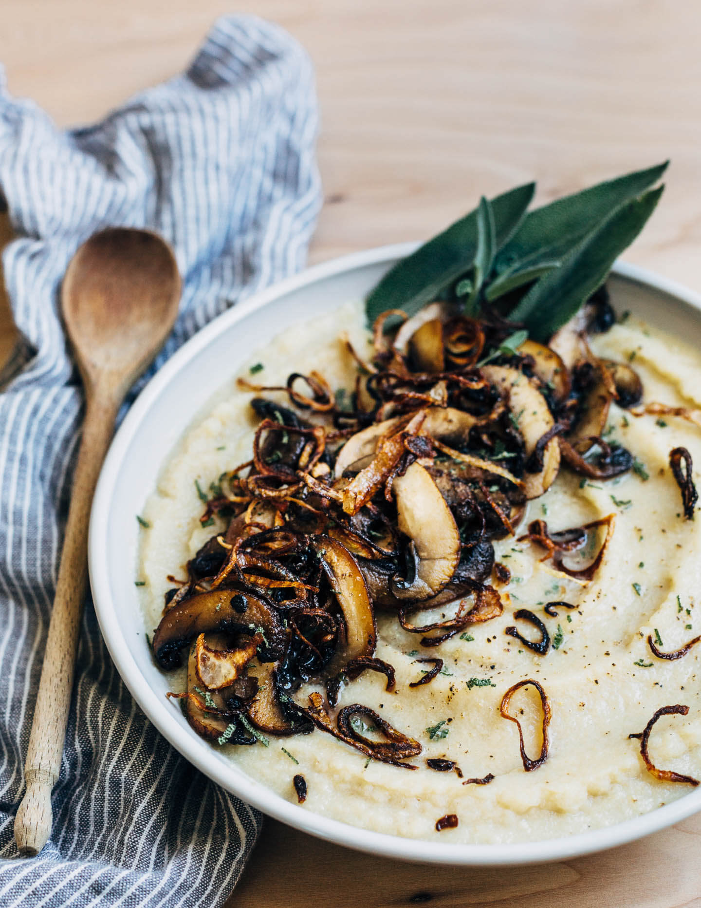 Silky cauliflower puree topped with crispy shallots and sautéed mushrooms. 