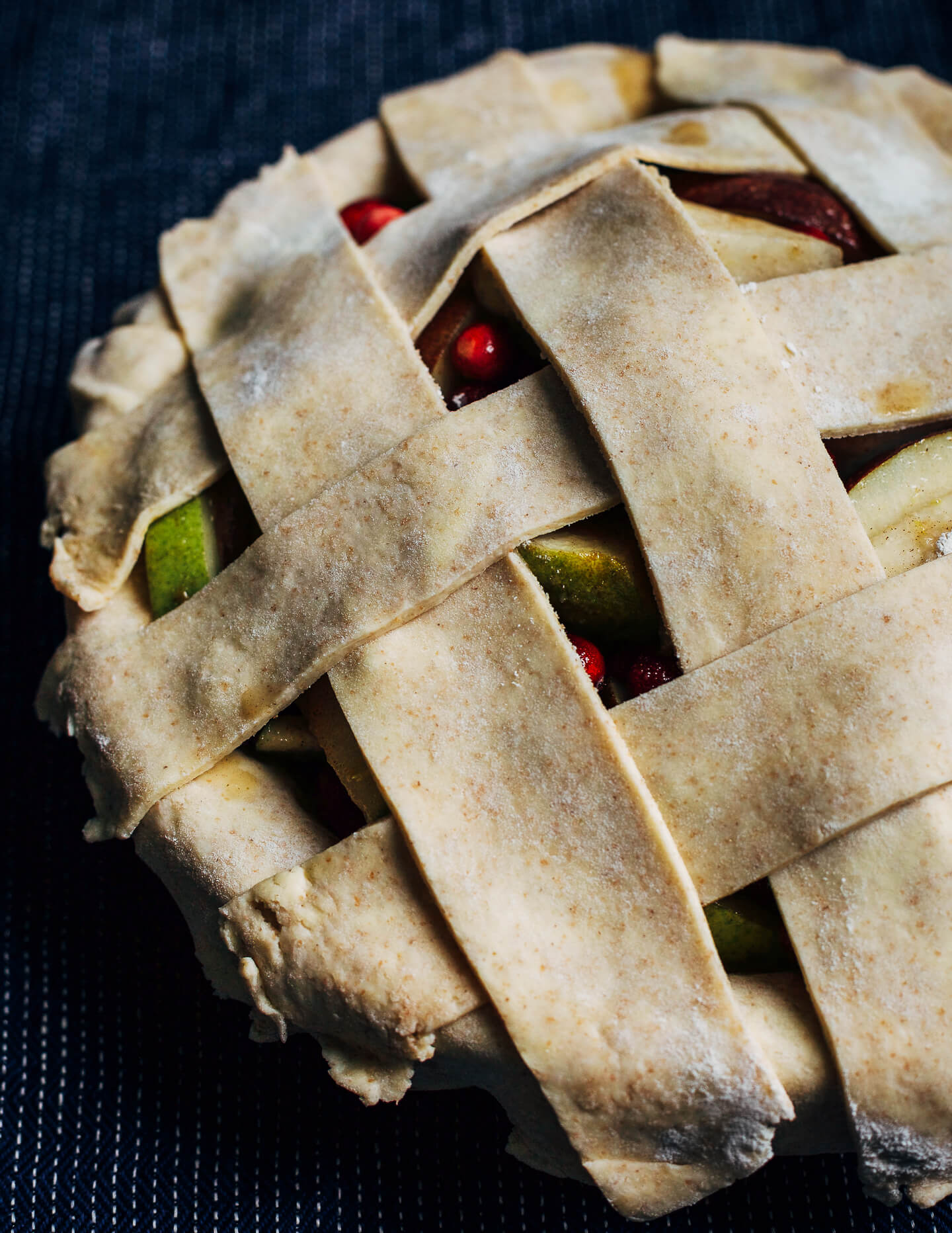 Homemade rye flour crust arranged in a wide lattice. 