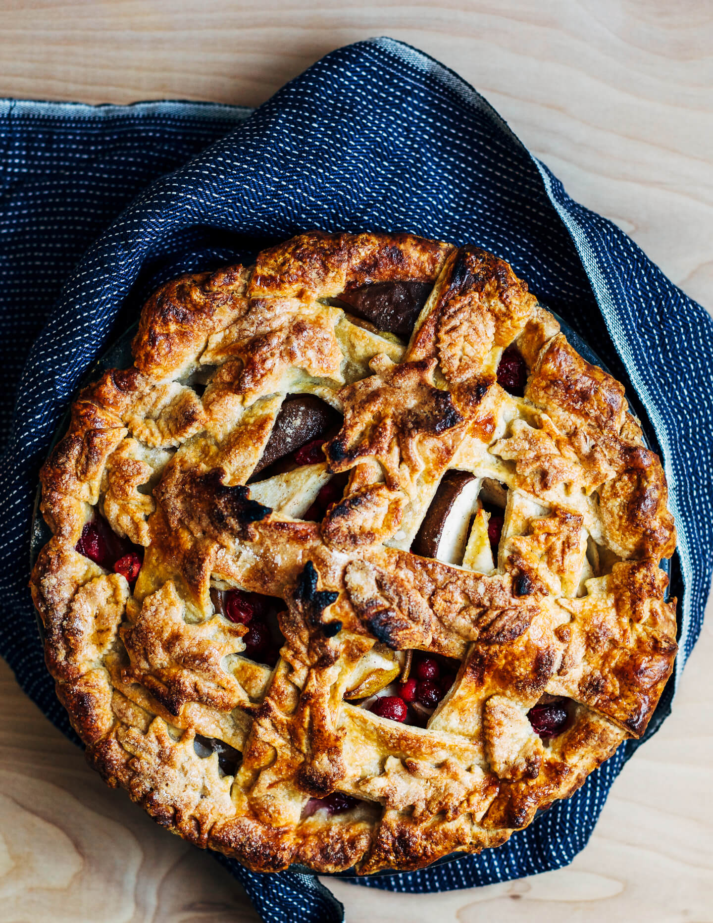 A beautiful cranberry pear pie with an incredibly flaky decorative rye crust. Pears and cranberries complement each other wonderfully, the pears with their subtle sweetness and the cranberries with their bright tang.