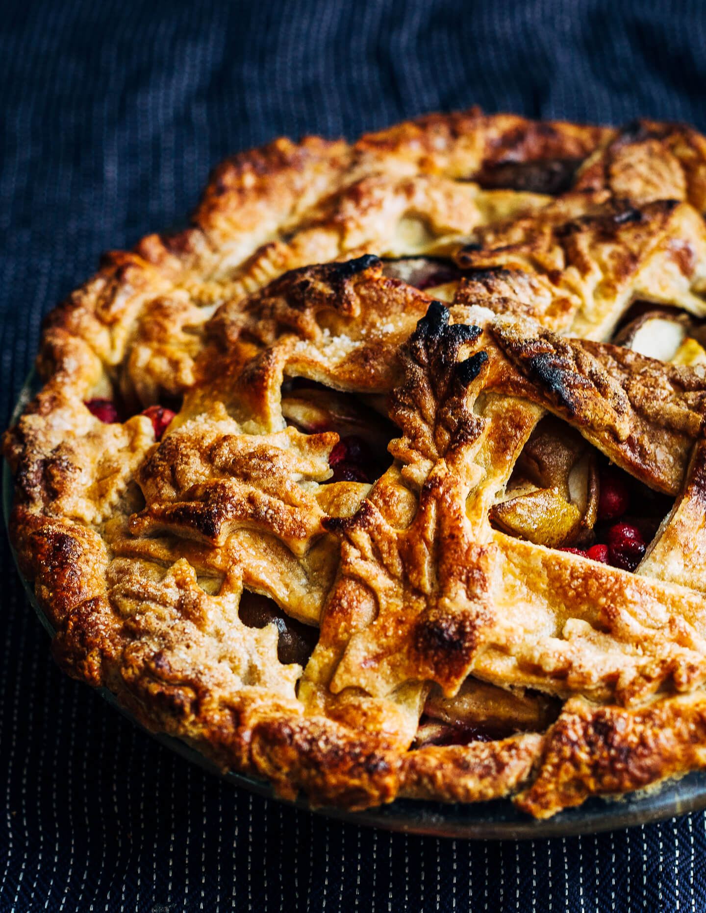 Cranberry pear pie with a decorative leaf rye crust. 