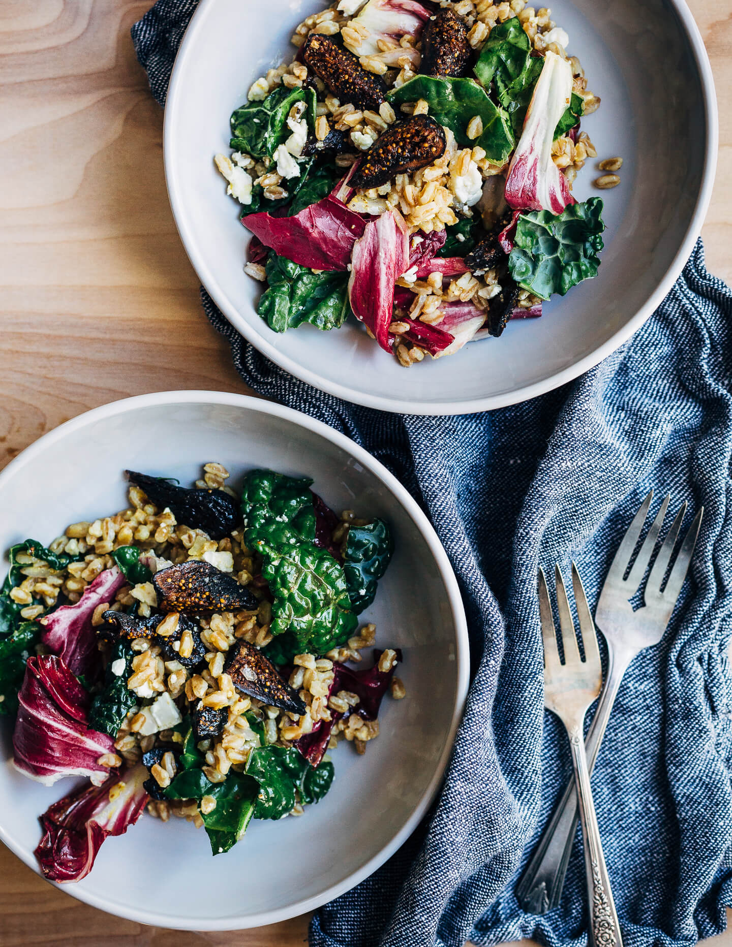A dried California Mission fig and whole grain farro salad that's incredibly versatile and hardy. It features kale and radicchio leaves tossed with warm farro and a punchy turmeric vinaigrette. The salad is topped off with crumbled feta and deliciously toothsome dried California Mission figs.