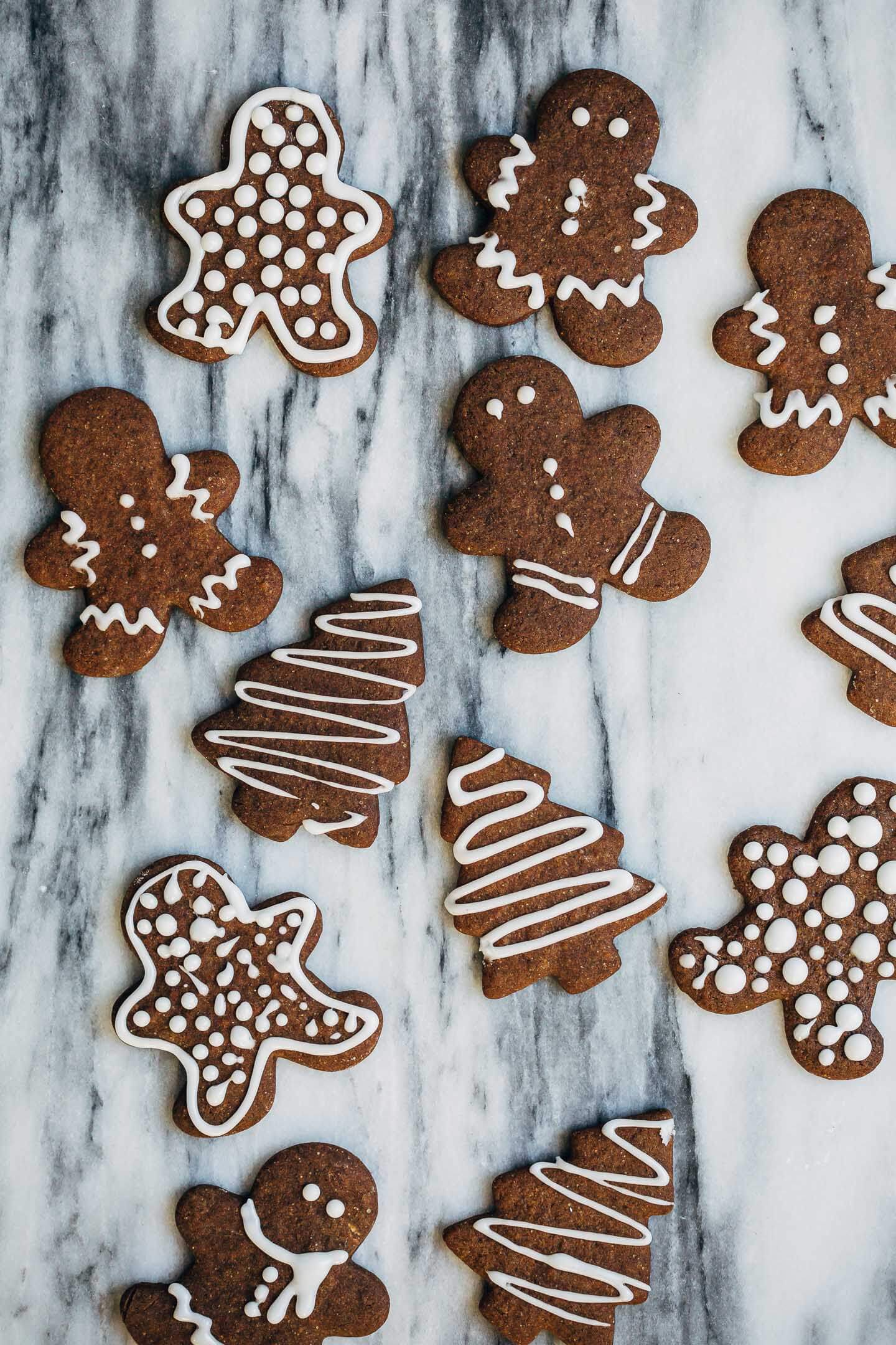 Spiced gingerbread cookies decorated with lemon icing. 