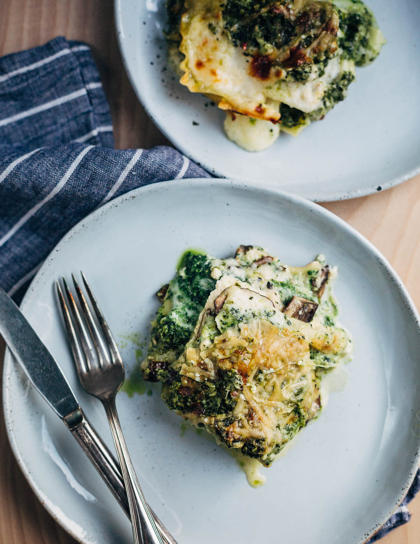 A savory vegetarian mushroom and pesto lasagna and thoughts on looking out for community in the midst of a crisis.
