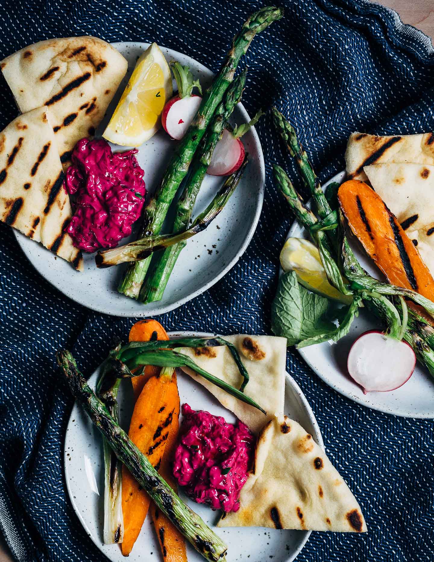 Super vibrant vegan beet tzatziki served with grilled asparagus, spring carrots, and naan. 