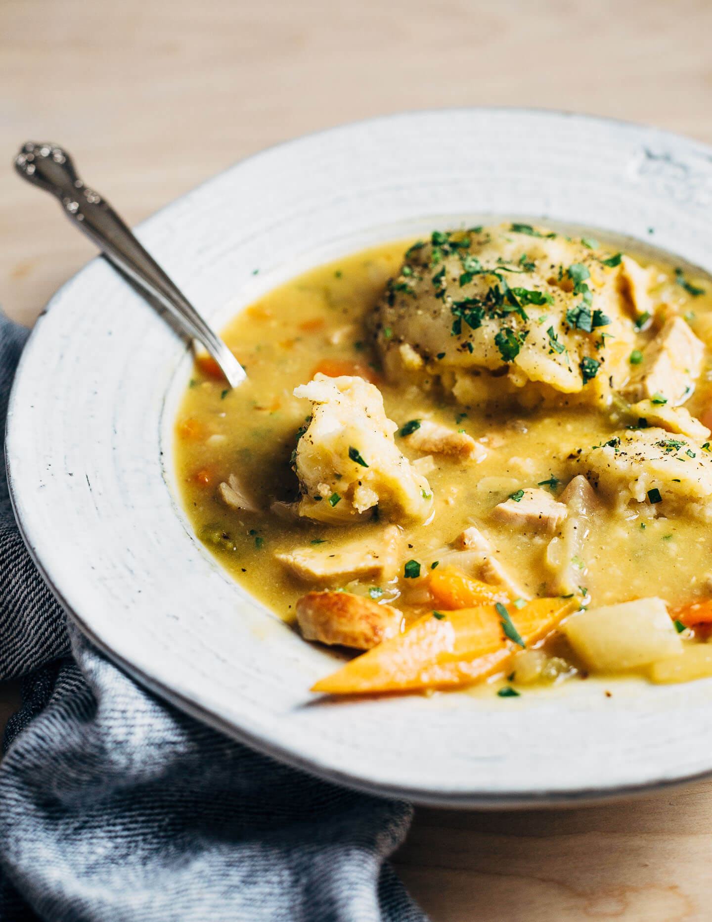 A bowl of chicken and dumpling soup.