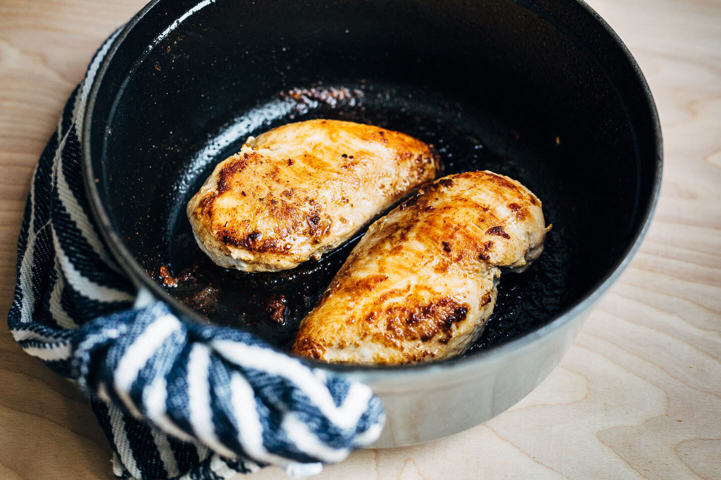 Chicken breasts seared in butter. 