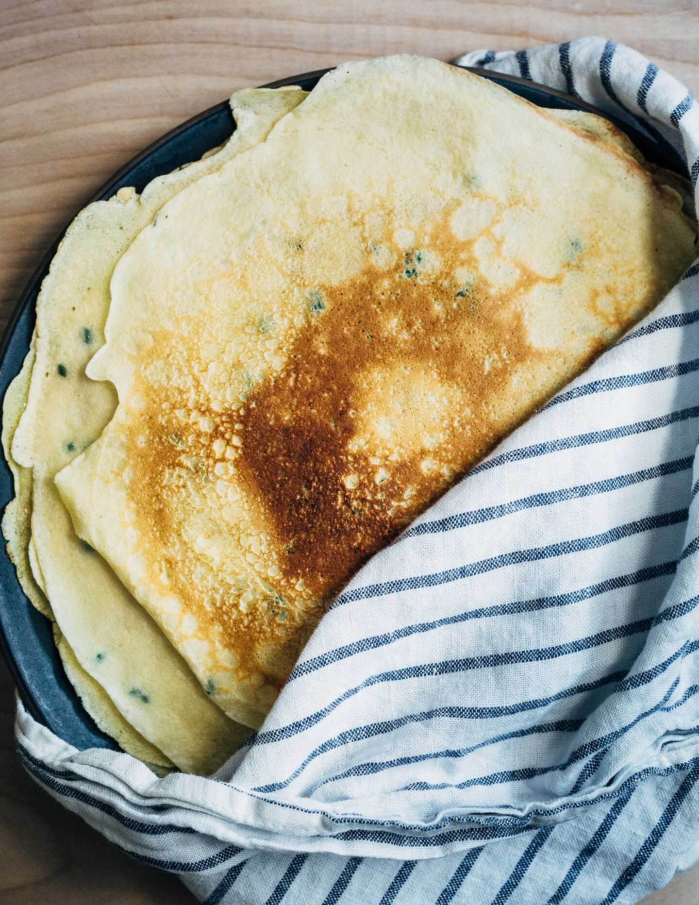 A stack of cooked crepes. 