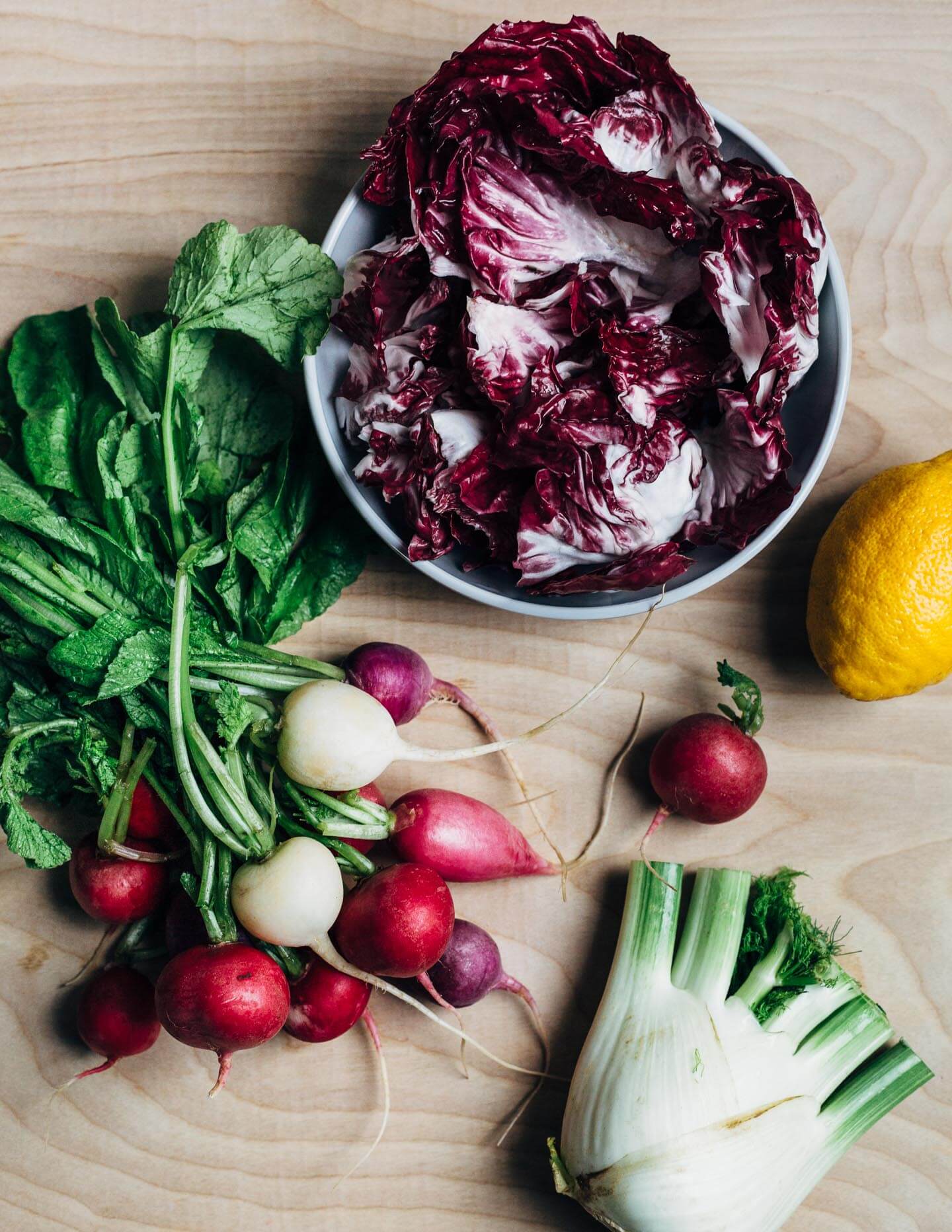 Salad ingredients: radishes, fennel, and radicchio