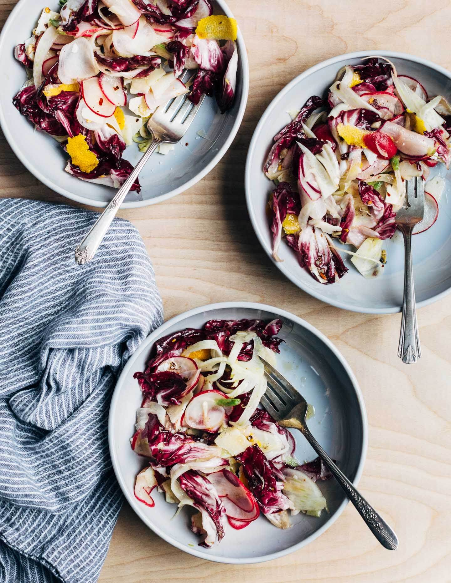  A punchy shaved radish and Parmesan salad featuring shaved radishes, fennel, and Parmesan tossed with radicchio, lemon zest, spicy olive oil, and nutty fried garlic. 