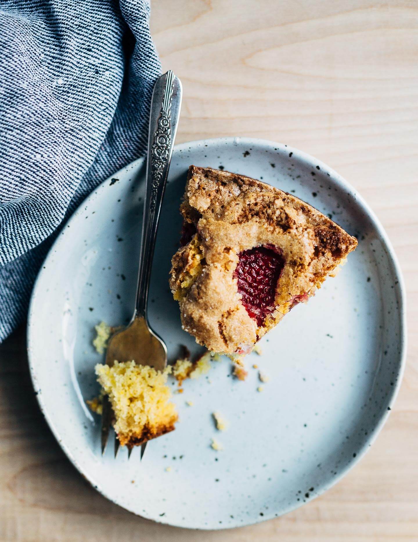 A slice of strawberry cornmeal cake. 