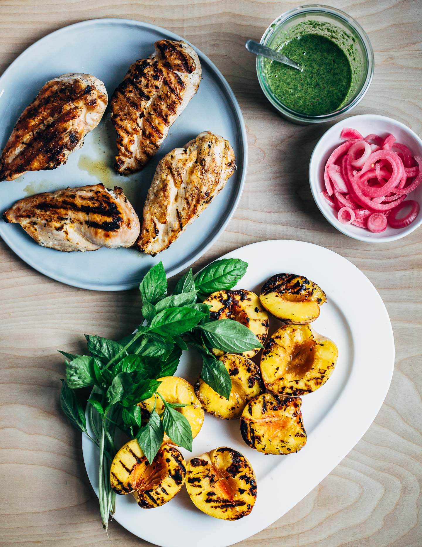 Grilled chicken and peach salad ingredients, ready to assemble. 