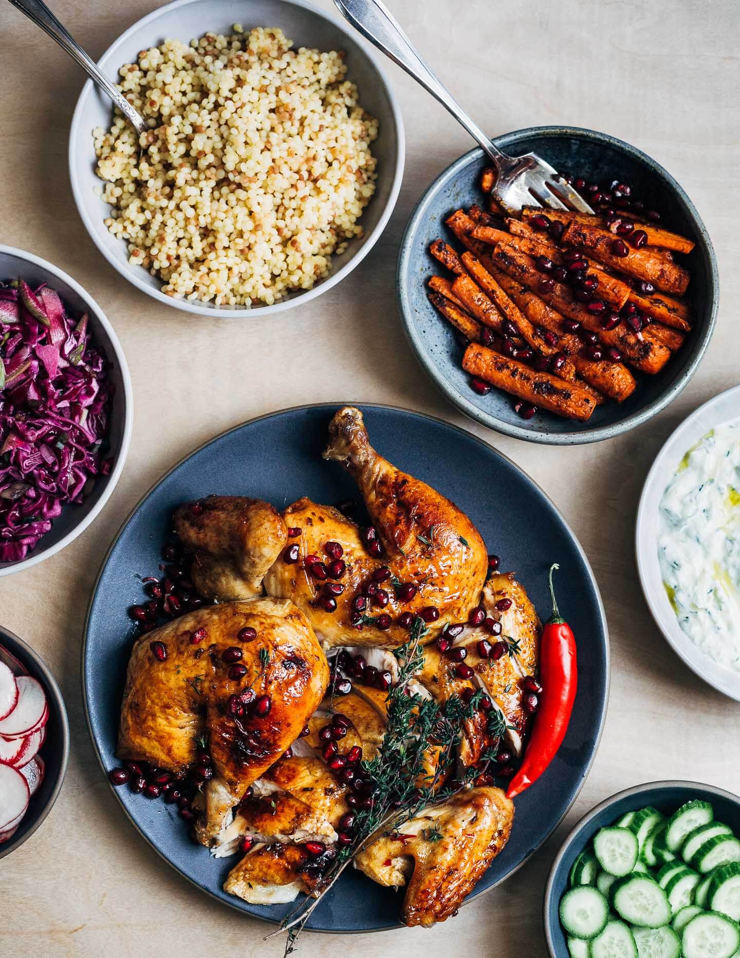 Make a Christmas feast to remember with this sumptuously flavored pomegranate-glazed roasted chicken and a host of colorful sides.