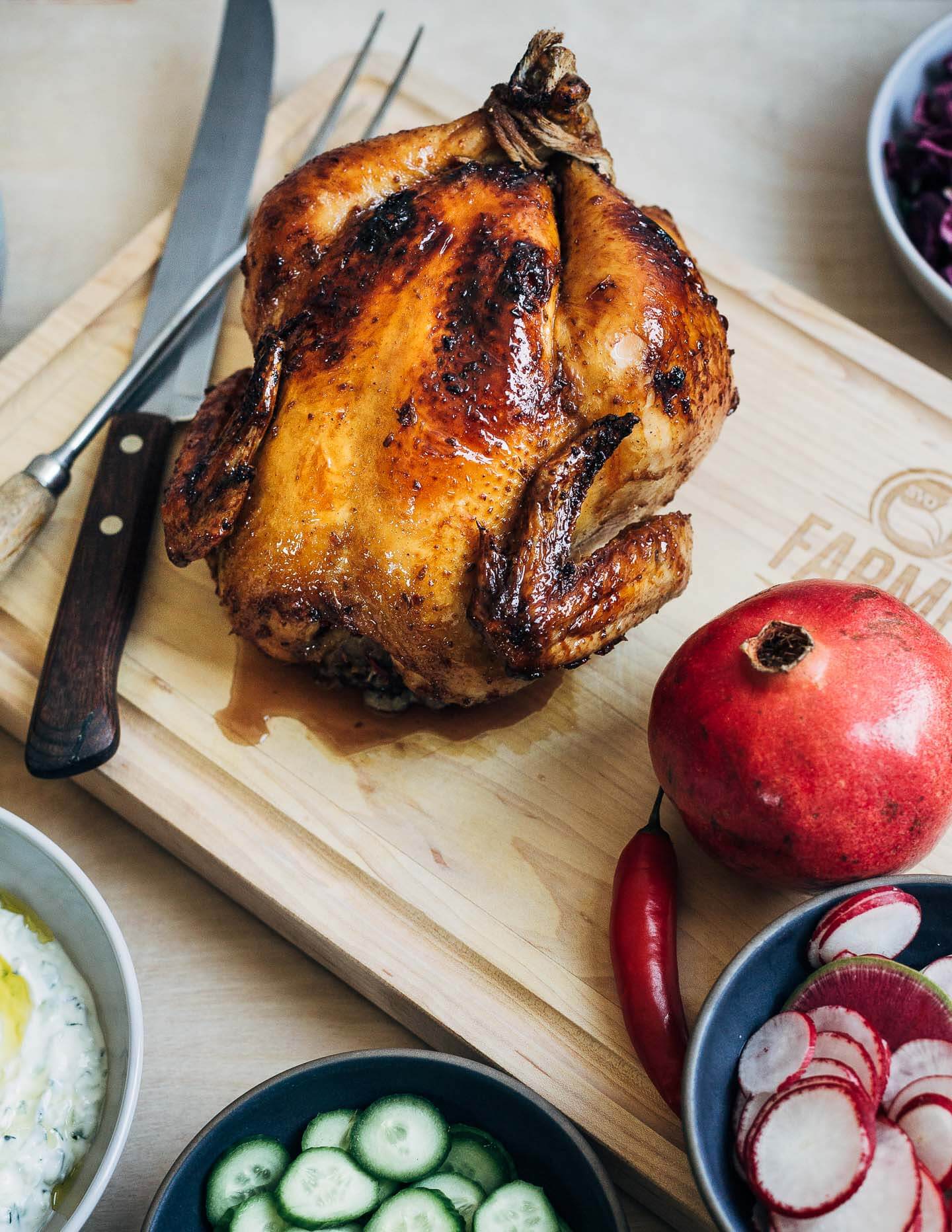 Pomegranate-glazed roasted chicken, ready to carve. 